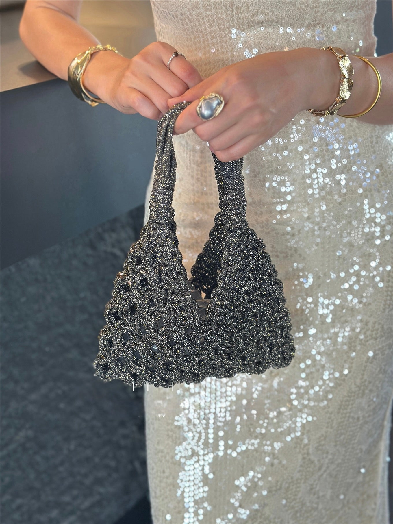 Sparkling rhinestone wine tote bag held by woman in sequin dress, perfect for luxury gifts and celebrations