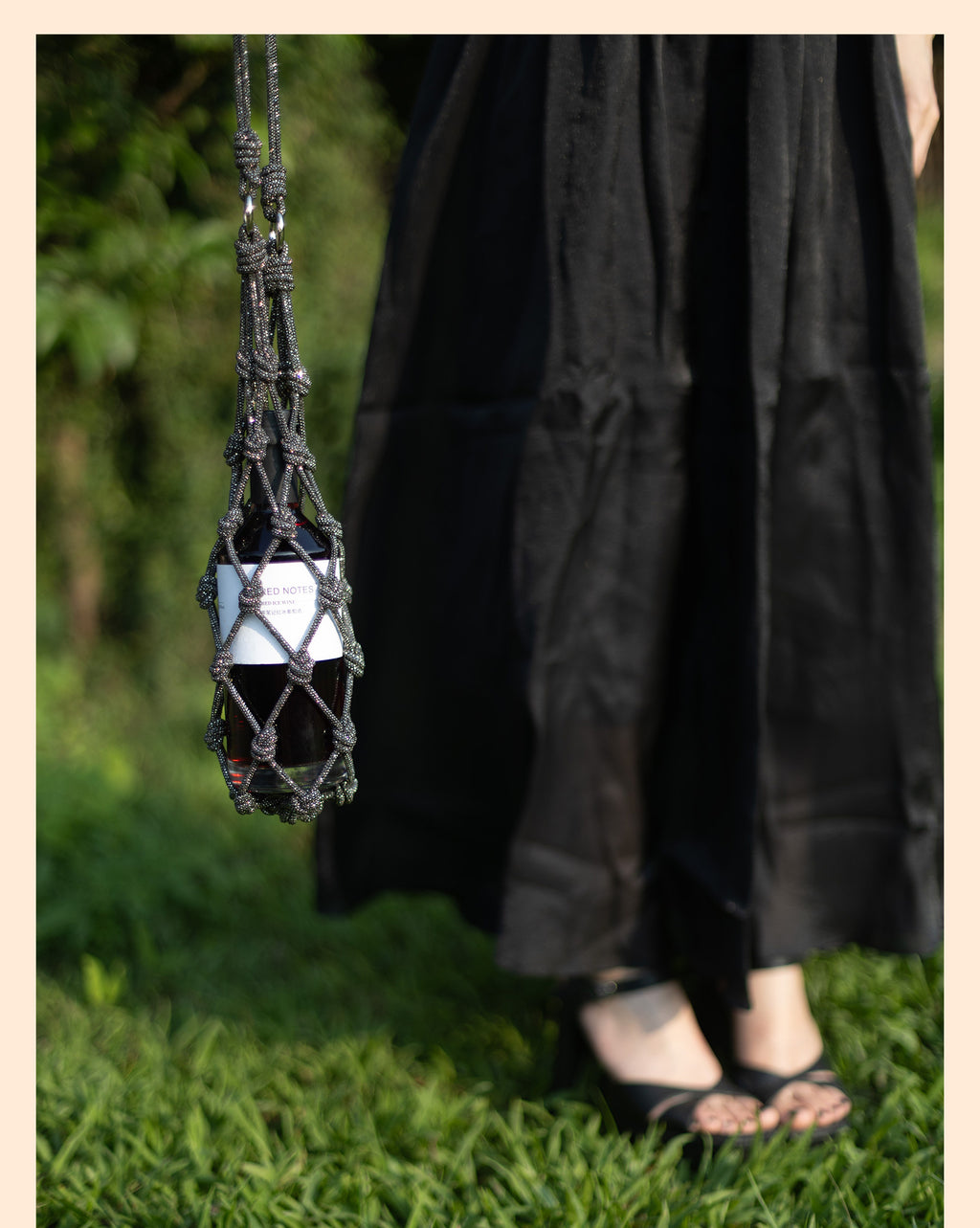 Sparkling rhinestone wine tote bag holding a bottle, perfect for luxury wine gifts and parties.