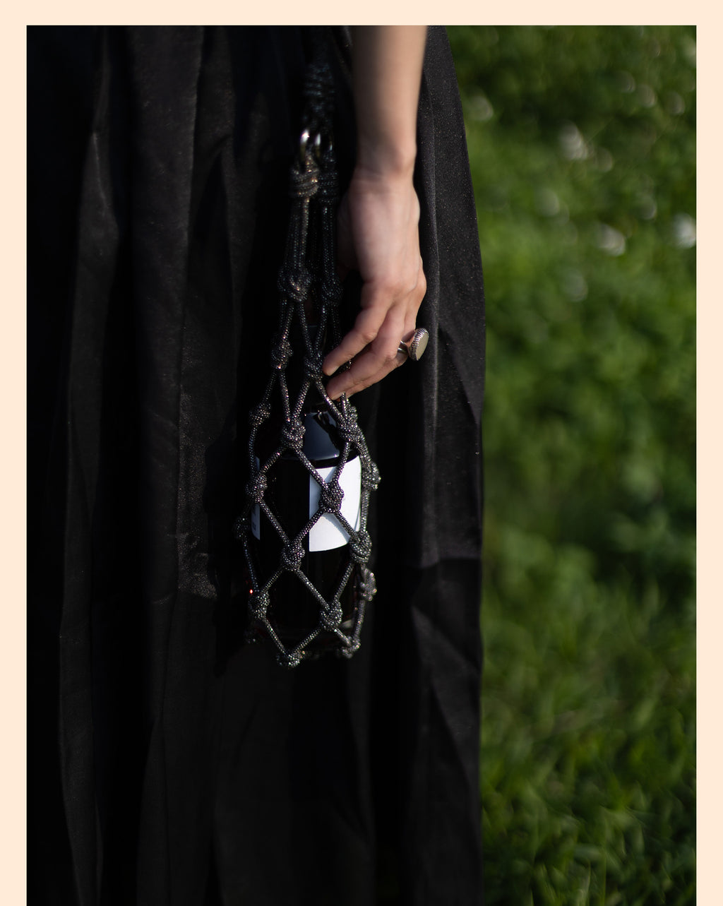 Elegant rhinestone wine tote bag holding a bottle, perfect for luxury wine gifts and celebrations.