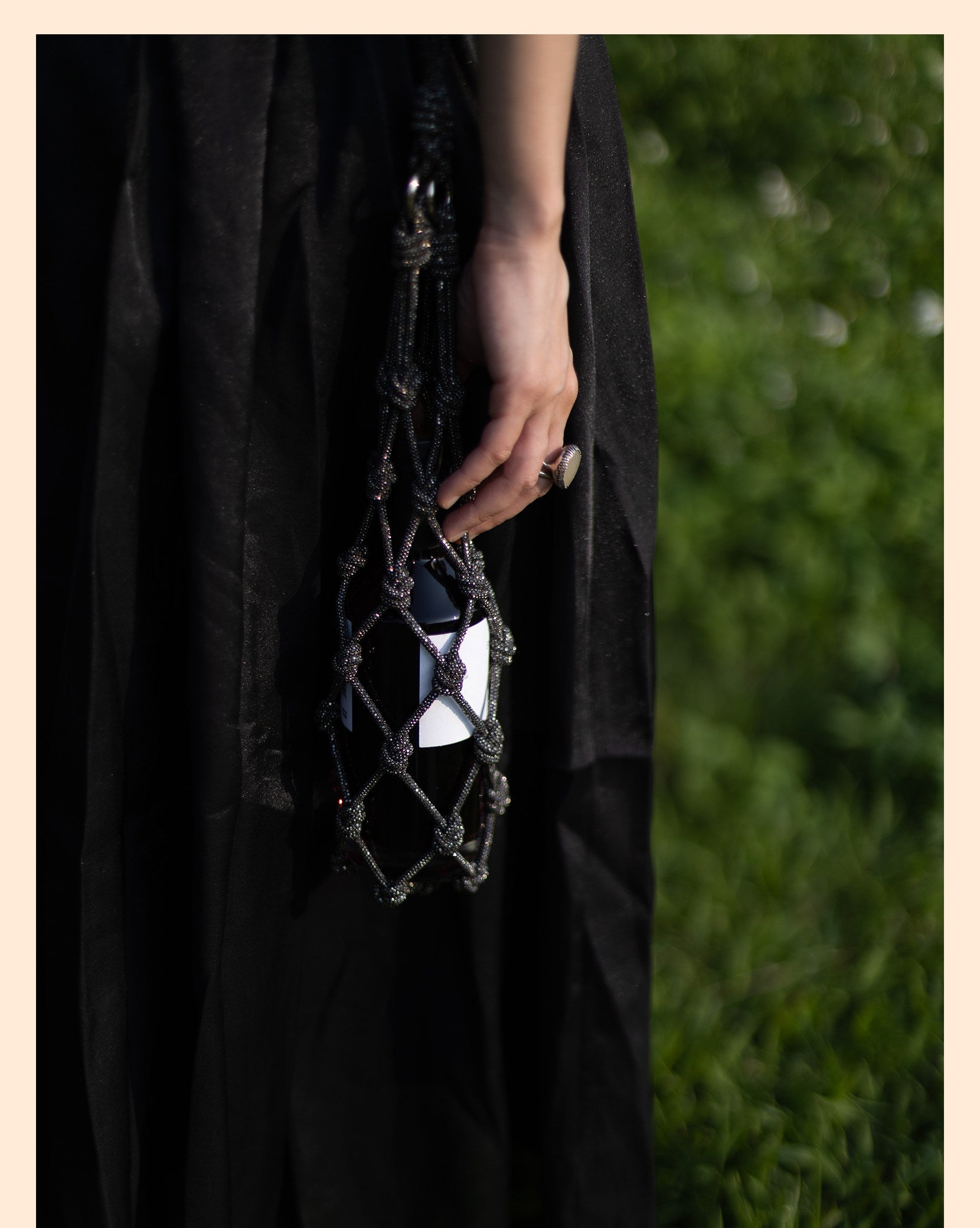 Elegant rhinestone wine tote bag holding a bottle, perfect for luxury wine gifts and celebrations.