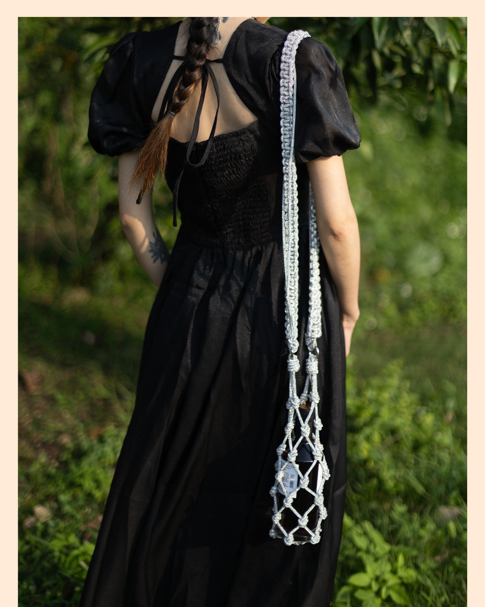 Sparkling rhinestone wine tote bag carried by woman in black dress, perfect for weddings and parties