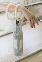 Sparkling rhinestone wine tote bag with cream handles, elegantly holding a wine bottle for parties or gifts.