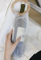 Elegant rhinestone wine tote bag with pearl mesh and marble handle, perfect for luxury wine gifts and celebrations.