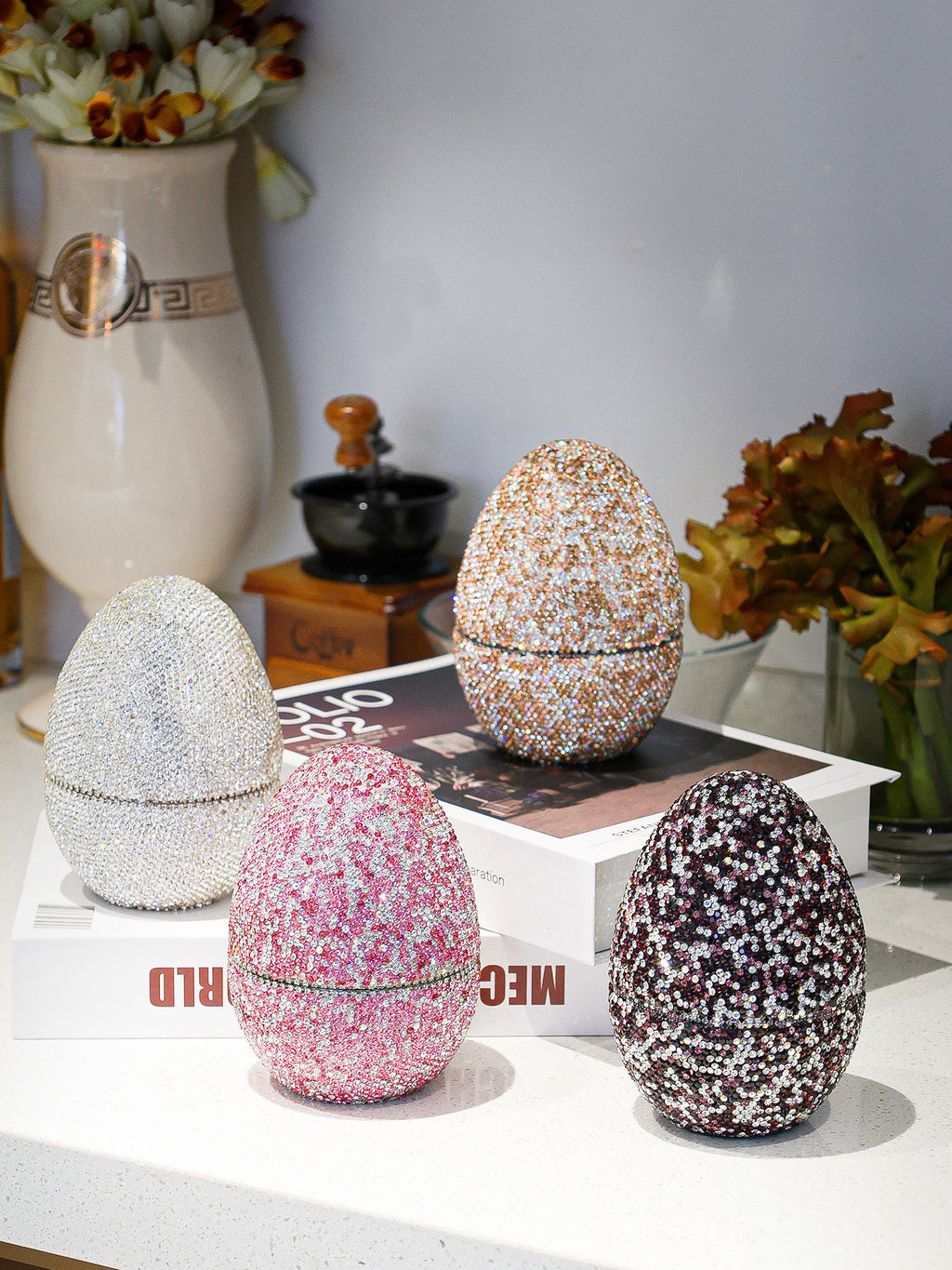 Sparkling rhinestone egg-shaped wine gift boxes in silver, pink, gold, and black for luxury celebrations