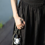 Elegant rhinestone wine tote bag held by woman in black dress, perfect for luxury wine gifts and celebrations.
