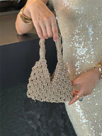 Hand holding beige macrame wine tote bag, perfect for luxury wine gifts and celebrations