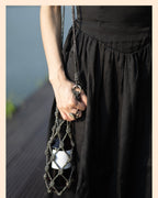 Elegant rhinestone wine tote bag with black beaded net, perfect for luxury wine gifts and celebrations.