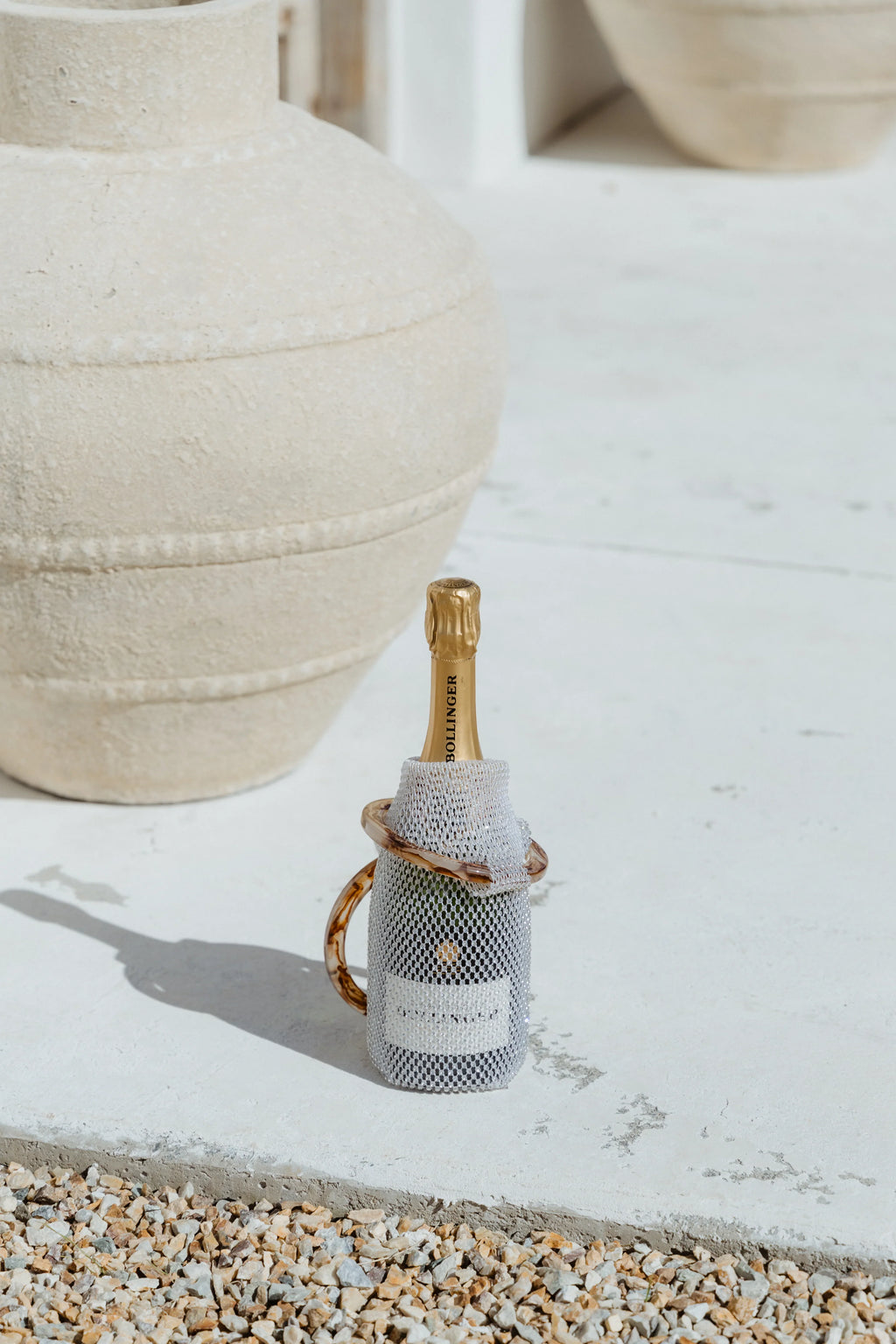 Sparkling rhinestone wine tote bag holding Bollinger champagne, luxury gift for weddings and parties
