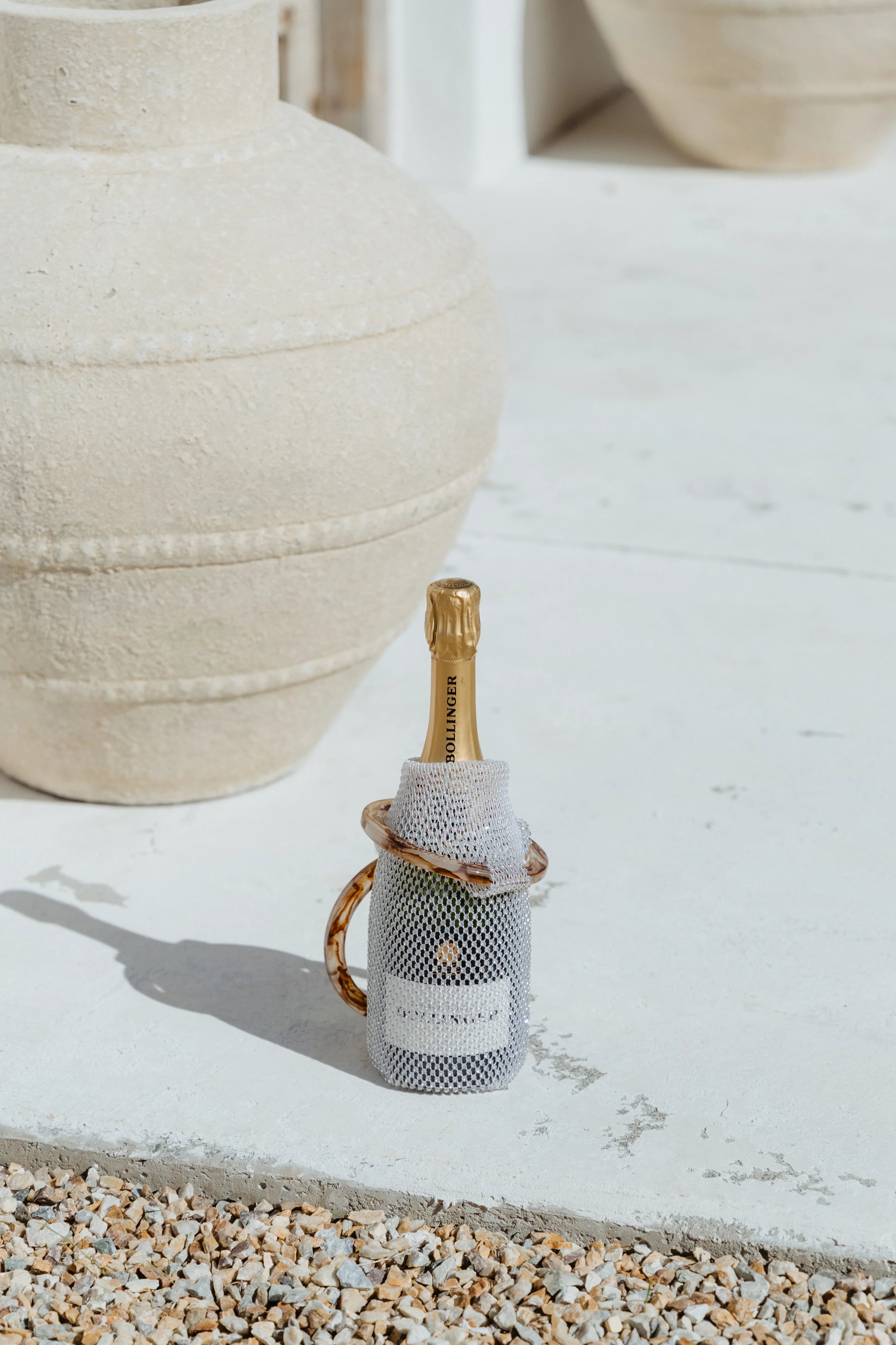 Sparkling rhinestone wine tote bag holding Bollinger champagne, luxury gift for weddings and parties