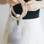 Elegant rhinestone wine tote bag with marble handle, perfect for luxury wine gifting and celebrations.